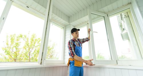 Replacement Windows: When You Need Them & How to Shop for Them Male Contractor Replacing Window