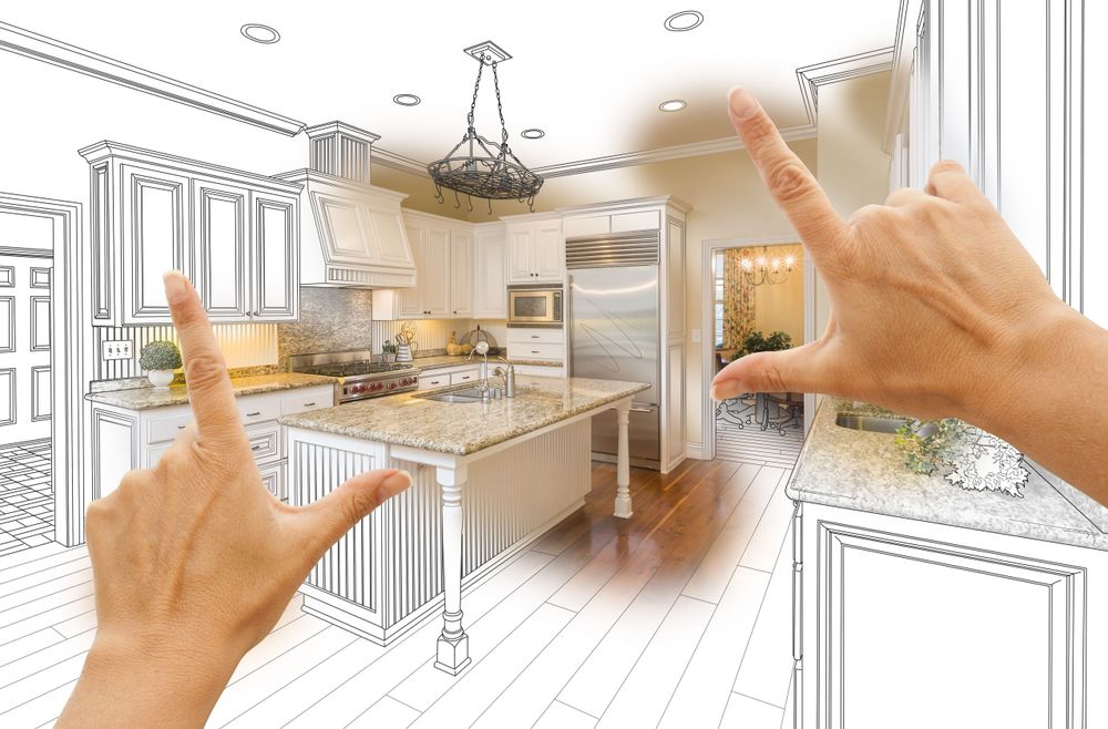 Hands envisioning new kitchen cabinetry. Hands envisioning new kitchen cabinetry.