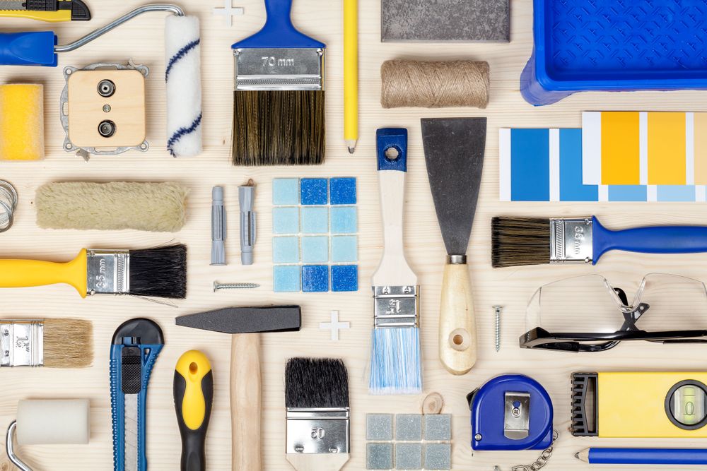 Flat Layout of Blue and Yellow Painting Accessories And Tools. Flat Layout of Blue and Yellow Painting Accessories And Tools.