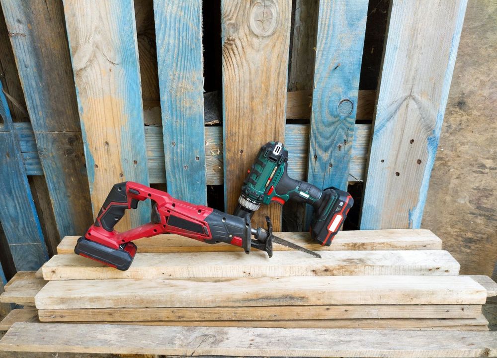Sawzall and Drill/Driver Staged On Small Pile of 2x4s Sawzall and Drill/Driver Staged On Small Pile of 2x4s