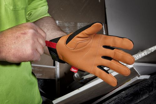 Gloves: The Importance of Protecting Your Hands During DIY Home Repairs Contractor putting on work gloves