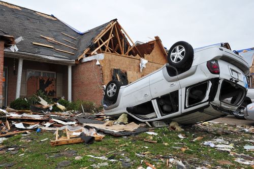 Top 10 Tornado Recovery Hardware Essentials home severely damaged by tornado; white suv overturned in front yard